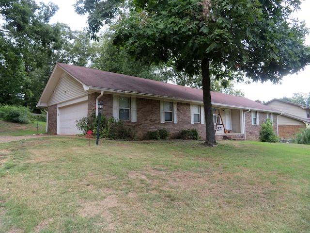 single story home featuring a front lawn and a garage