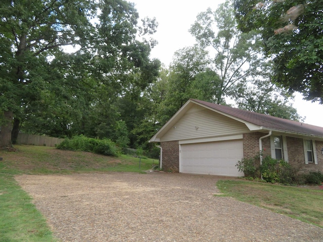 exterior space featuring a yard and a garage