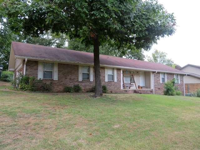 single story home featuring a front yard