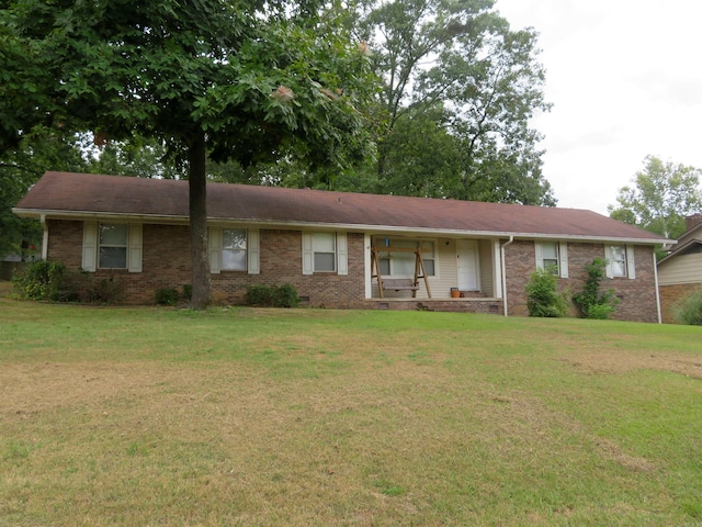 ranch-style house featuring a front lawn