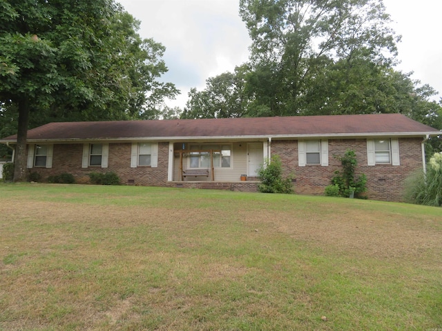 ranch-style home with a front lawn