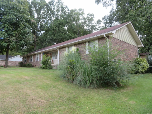 view of property exterior featuring a yard