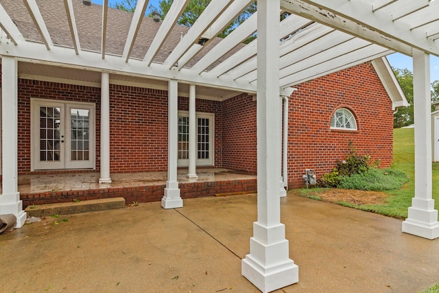 view of patio / terrace with french doors and a pergola