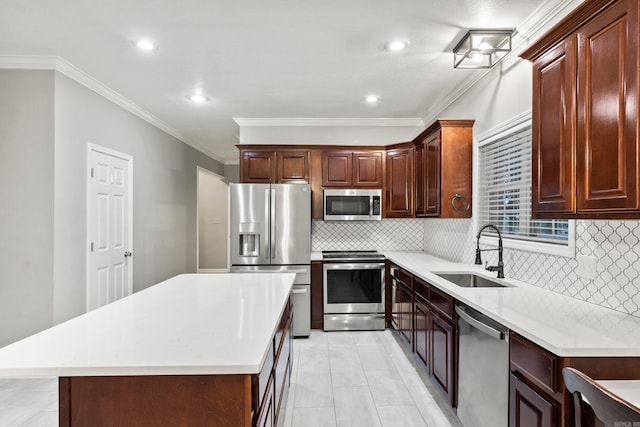 kitchen with stainless steel appliances, a sink, and light countertops