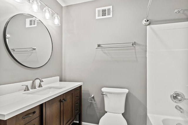 full bathroom featuring washtub / shower combination, visible vents, vanity, and toilet