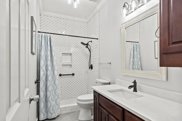 bathroom featuring visible vents, toilet, ornamental molding, vanity, and tiled shower