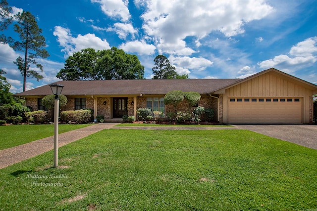 ranch-style house with a garage and a front lawn