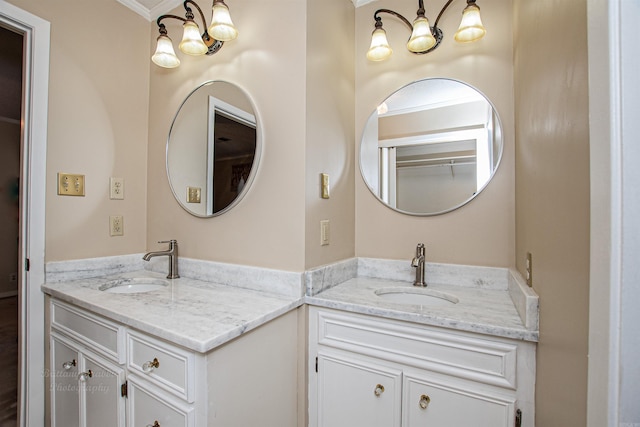 bathroom with ornamental molding and vanity