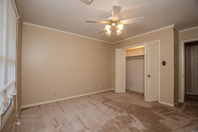 unfurnished bedroom featuring a textured ceiling, ceiling fan, and carpet flooring