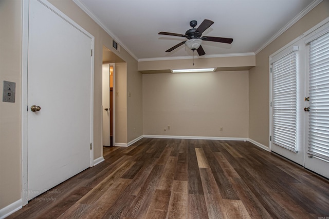 empty room with crown molding, dark wood-type flooring, and ceiling fan