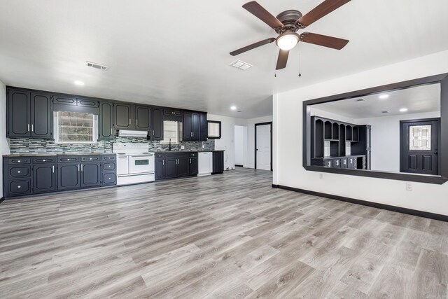 kitchen with white appliances, ceiling fan, sink, and light hardwood / wood-style flooring