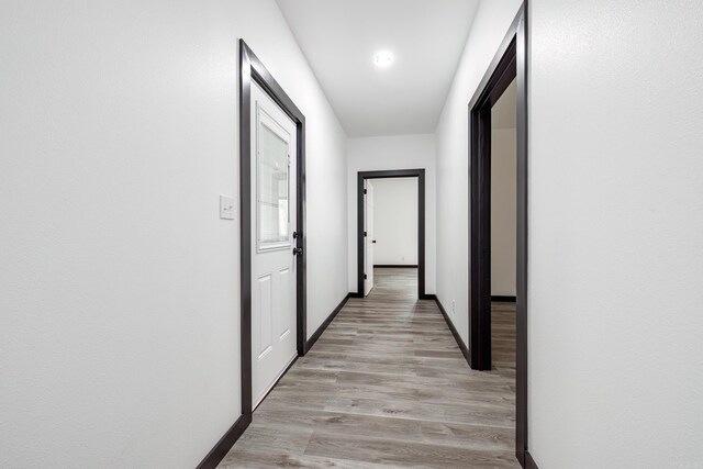 hallway with light wood-type flooring