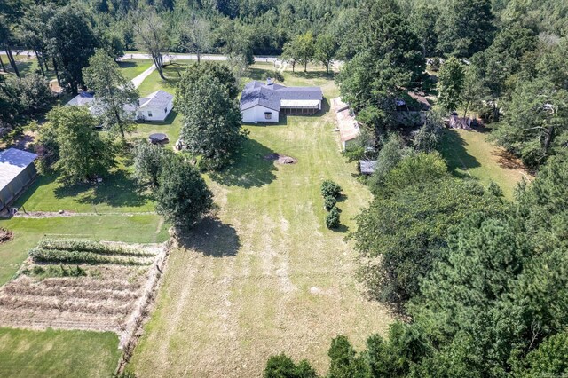 birds eye view of property with a rural view