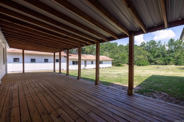 wooden deck with a lawn