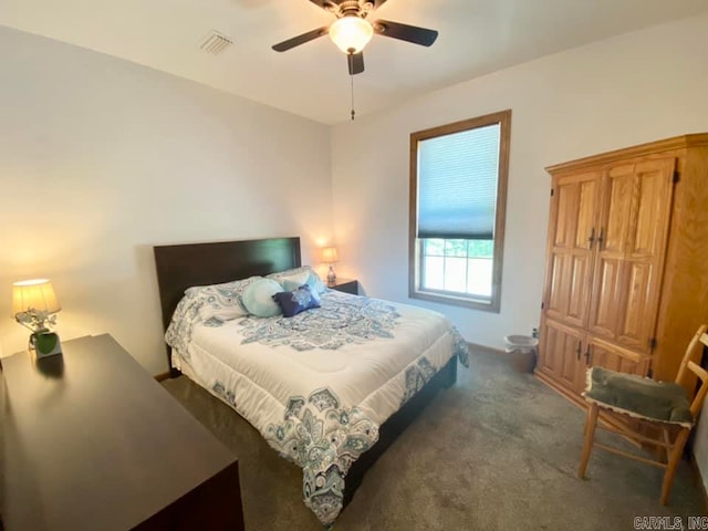 bedroom with dark colored carpet and ceiling fan