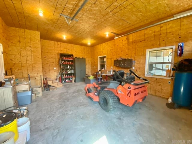 garage featuring wood walls