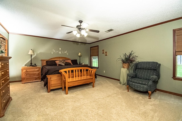 bedroom featuring carpet, visible vents, crown molding, and baseboards