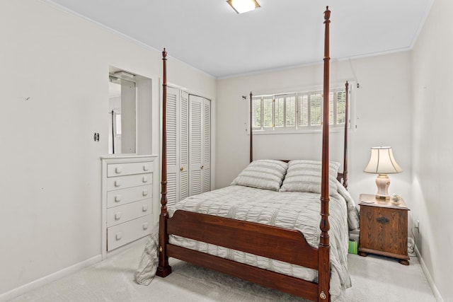 carpeted bedroom featuring ornamental molding and a closet