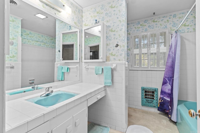 bathroom featuring shower / bath combo, tile walls, vanity, and heating unit