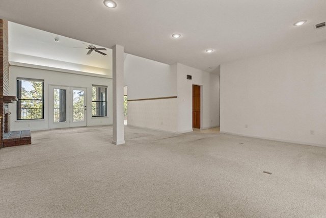 unfurnished living room featuring ceiling fan, recessed lighting, and light carpet