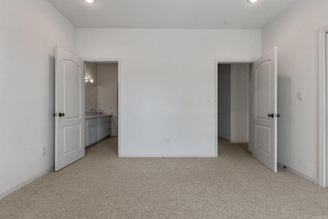 unfurnished bedroom with light colored carpet