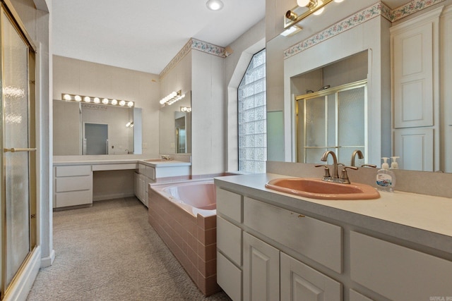 full bath featuring a bath, a shower stall, and vanity