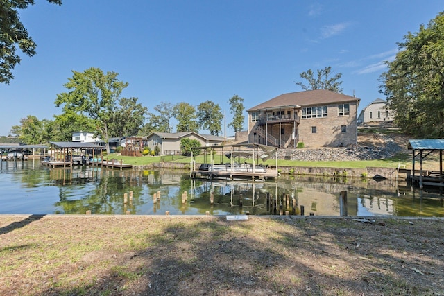 view of dock with a water view and a balcony