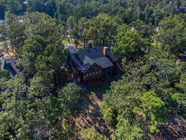 drone / aerial view featuring a forest view