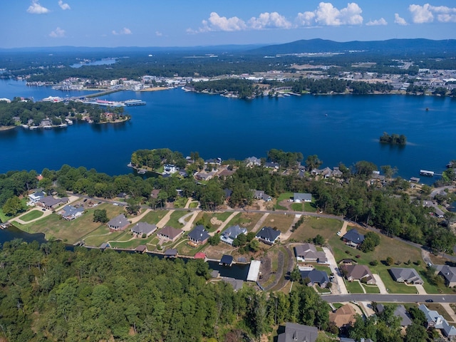 drone / aerial view featuring a water view and a residential view