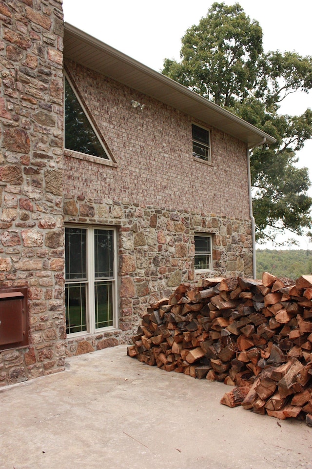 view of side of home with a patio area