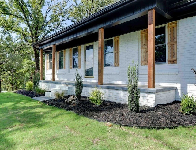 view of side of home with covered porch