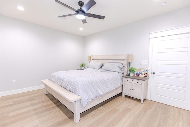 bedroom featuring light hardwood / wood-style flooring and ceiling fan