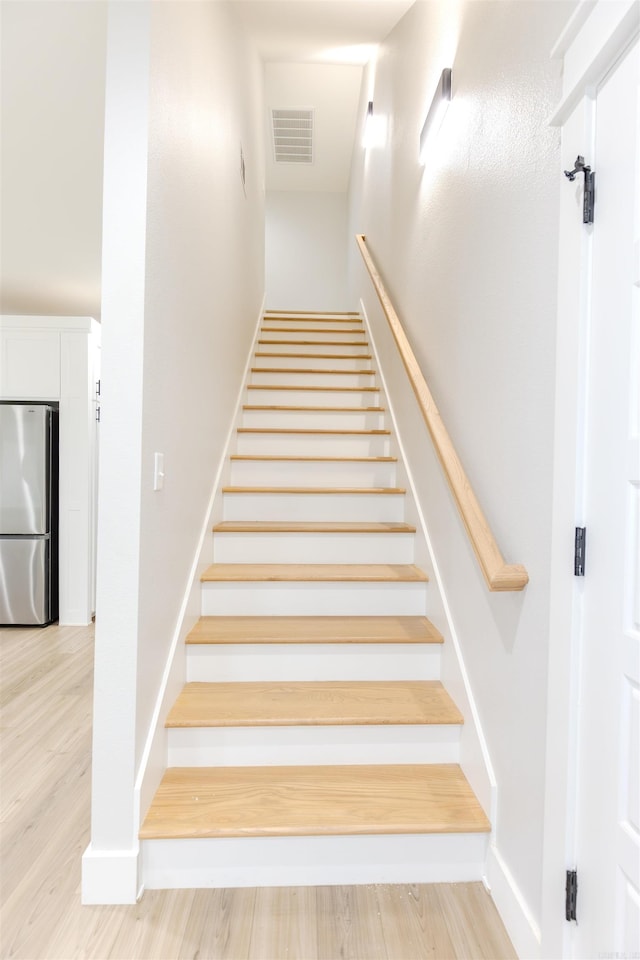 staircase featuring hardwood / wood-style floors