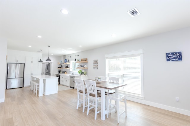 dining room featuring light wood-type flooring