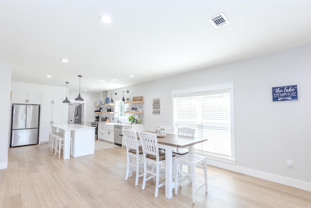 211 Woodland Shores Cir, Clinton, AR 72031 - dining space featuring light wood finished floors, baseboards, visible vents, and recessed lighting
