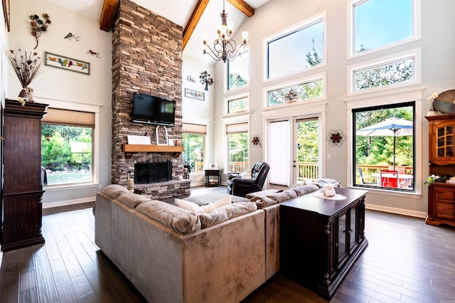 living room with plenty of natural light, beamed ceiling, and high vaulted ceiling