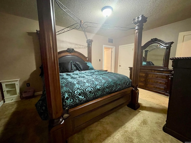 bedroom with carpet and a textured ceiling