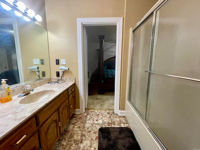 bathroom featuring vanity and enclosed tub / shower combo