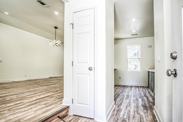 bar with lofted ceiling, hardwood / wood-style floors, ceiling fan, and a brick fireplace