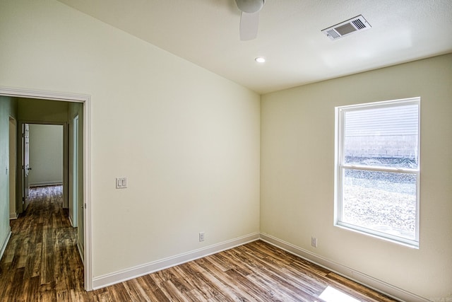 unfurnished room with hardwood / wood-style floors and ceiling fan