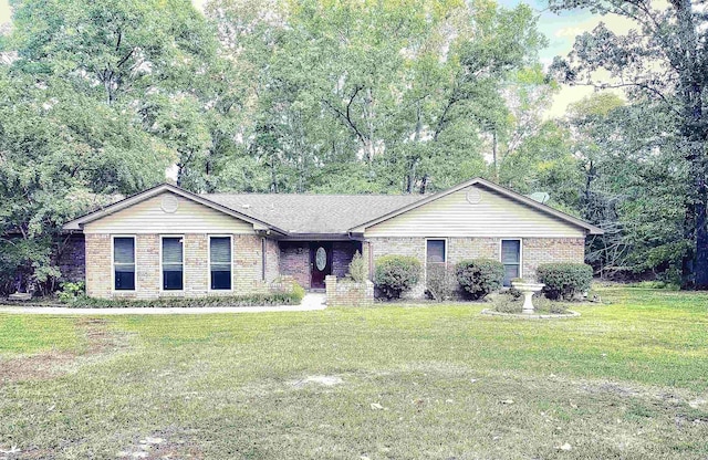 ranch-style home with brick siding and a front lawn