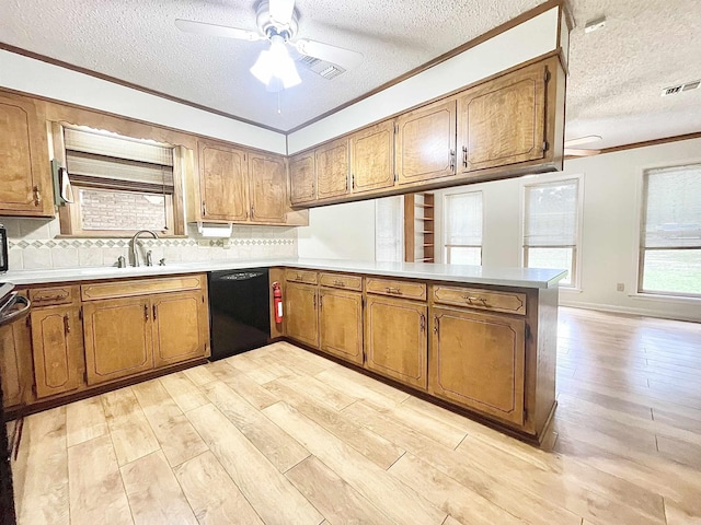 kitchen featuring a peninsula, ornamental molding, dishwasher, light wood finished floors, and brown cabinetry