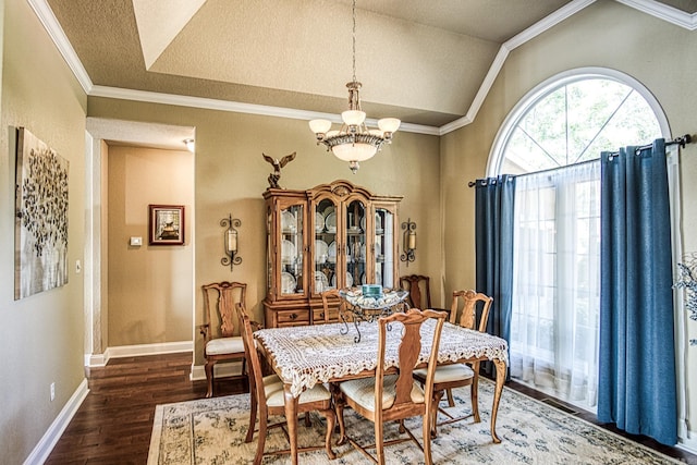 dining room featuring lofted ceiling, crown molding, dark hardwood / wood-style floors, and a chandelier