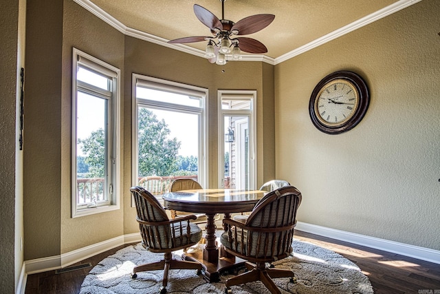 dining space featuring crown molding, a textured ceiling, hardwood / wood-style flooring, and ceiling fan