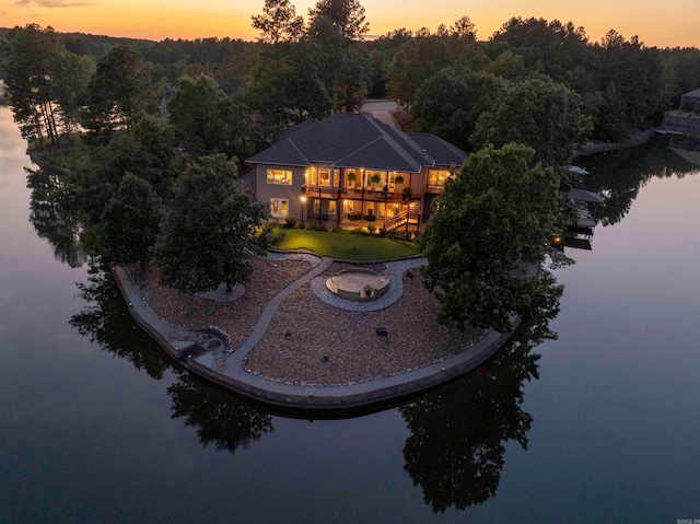 aerial view at dusk with a water view