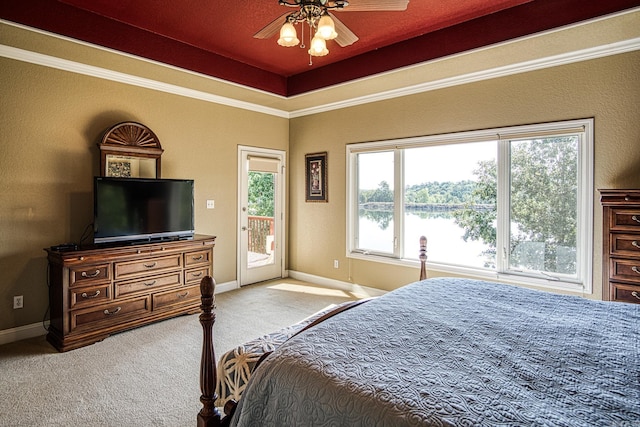 carpeted bedroom with ceiling fan, access to exterior, and crown molding