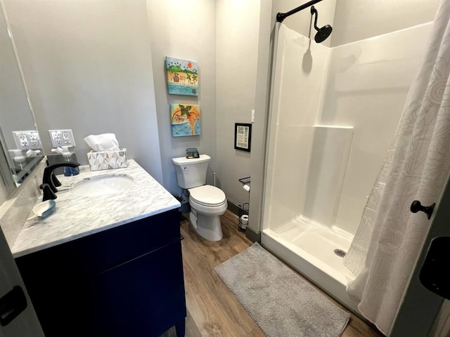 51 Yosemite Dr, Cherokee Village, AR 72529 - full bathroom with vanity, wood finished floors, a shower with shower curtain, and toilet