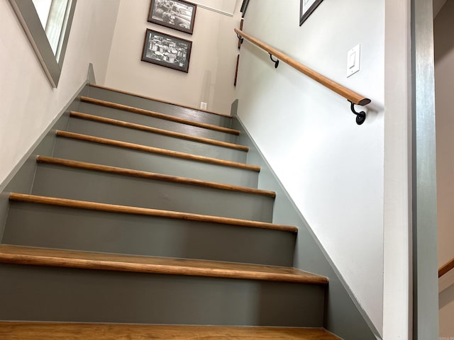 stairway featuring hardwood / wood-style floors