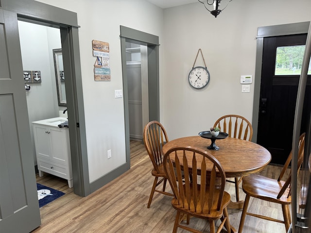 51 Yosemite Dr, Cherokee Village, AR 72529 - dining space with light wood-style flooring and baseboards