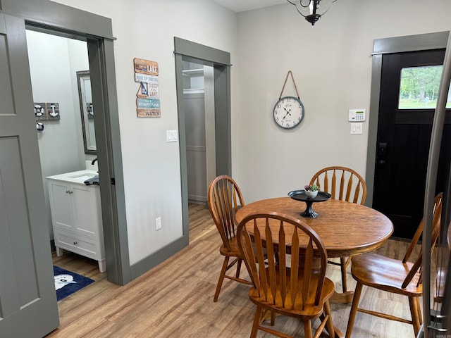 dining area with light hardwood / wood-style floors